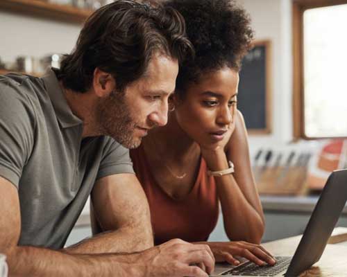 Couple looking at laptop