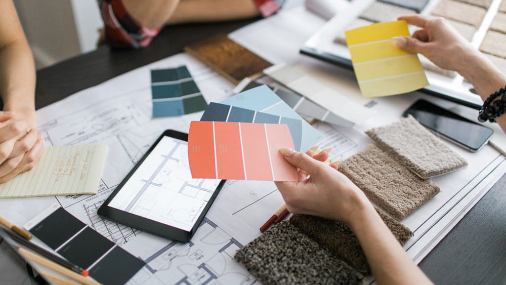 people looking at colour swatches
