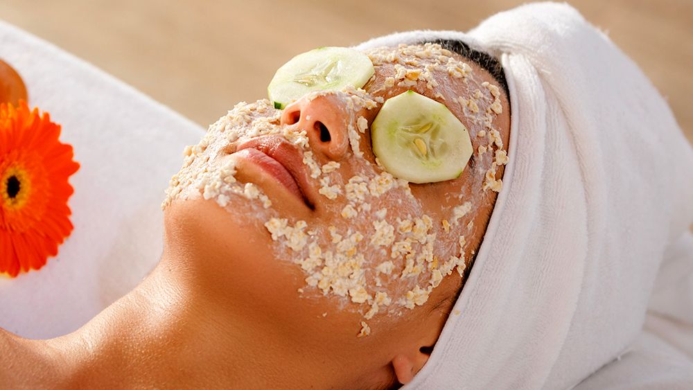 Woman with skin care face mask 